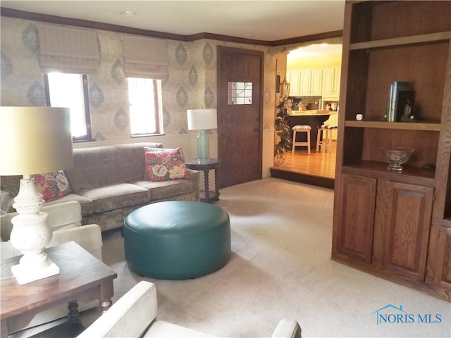 3704 Brookside Rd, Ottawa Hills, OH 43606 - living area with ornamental molding, light colored carpet, and wallpapered walls