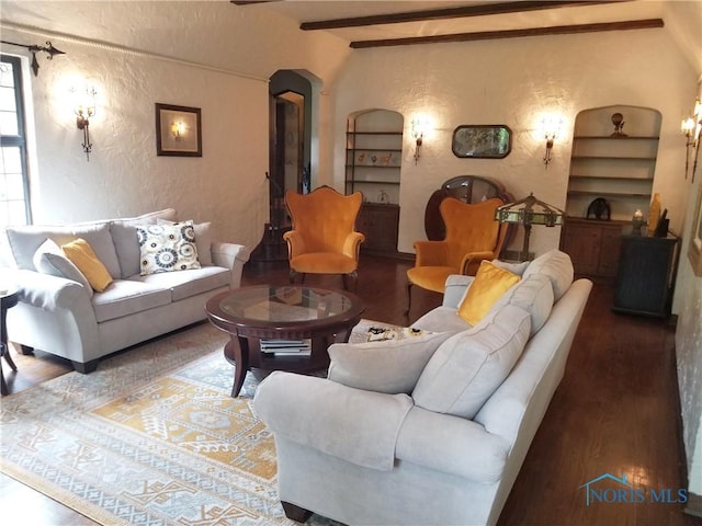 3704 Brookside Rd, Ottawa Hills, OH 43606 - living area featuring a textured wall, wood finished floors, arched walkways, and beam ceiling