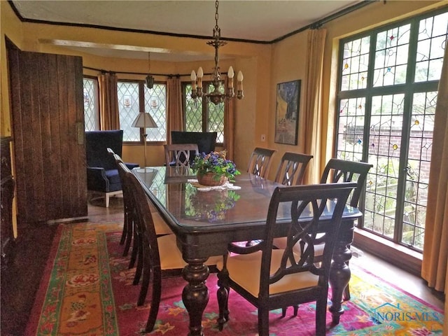 3704 Brookside Rd, Ottawa Hills, OH 43606 - dining area with a chandelier and crown molding