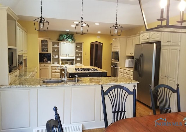 3704 Brookside Rd, Ottawa Hills, OH 43606 - kitchen with stainless steel appliances, a peninsula, open shelves, recessed lighting, and decorative light fixtures