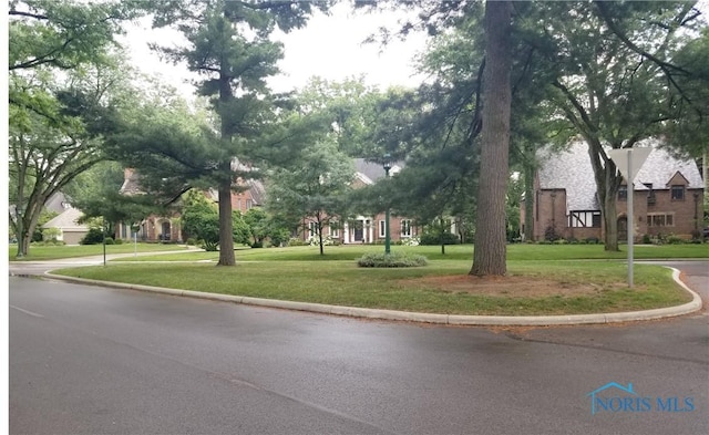 3704 Brookside Rd, Ottawa Hills, OH 43606 - view of asphalt road featuring curbs
