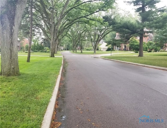 3704 Brookside Rd, Ottawa Hills, OH 43606 - view of asphalt road with curbs