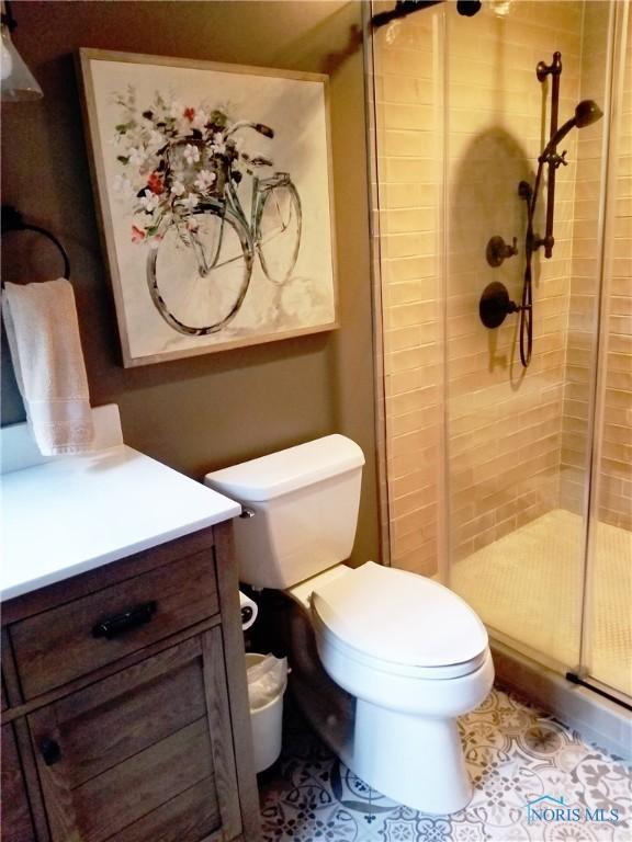 3704 Brookside Rd, Ottawa Hills, OH 43606 - bathroom with vanity, a shower stall, and tile patterned flooring
