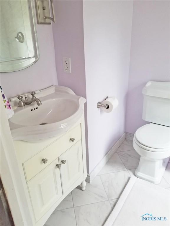 3704 Brookside Rd, Ottawa Hills, OH 43606 - bathroom with marble look tiles and vanity