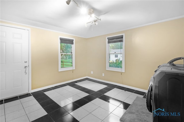 545 Wallace Ave, Bowling Green, OH 43402 - laundry area with washer / dryer, dark tile patterned flooring, and crown molding