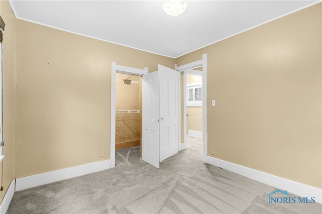 545 Wallace Ave, Bowling Green, OH 43402 - unfurnished bedroom with carpet flooring, a walk in closet, and a closet