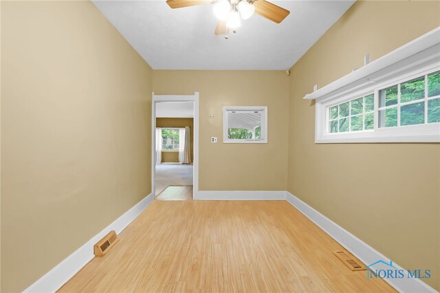 545 Wallace Ave, Bowling Green, OH 43402 - unfurnished room with wood finished floors, healthy amount of natural light, and a ceiling fan