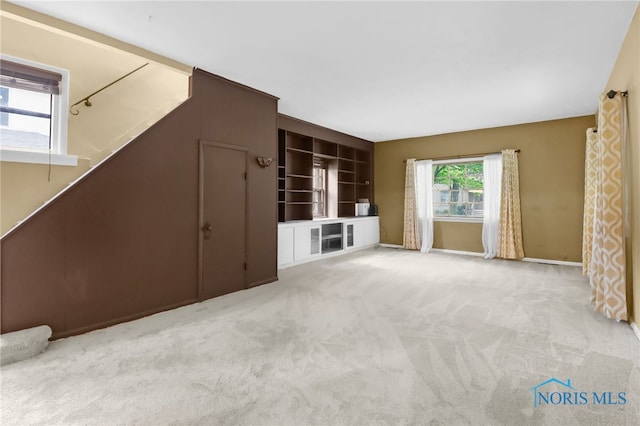 545 Wallace Ave, Bowling Green, OH 43402 - unfurnished living room with carpet floors and baseboards