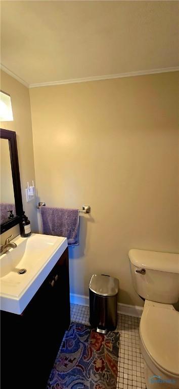3329 Kirkwall Rd, Ottawa Hills, OH 43606 - half bathroom featuring tile patterned floors, vanity, and ornamental molding
