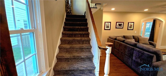 3329 Kirkwall Rd, Ottawa Hills, OH 43606 - staircase with arched walkways, wood finished floors, and recessed lighting