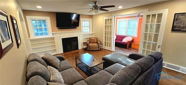 3329 Kirkwall Rd, Ottawa Hills, OH 43606 - living room with a glass covered fireplace, a ceiling fan, recessed lighting, and wood finished floors