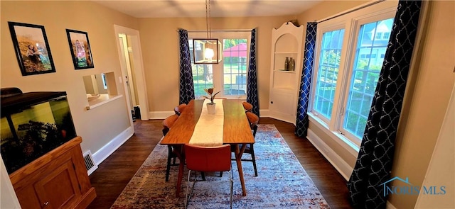 3329 Kirkwall Rd, Ottawa Hills, OH 43606 - dining room featuring dark wood finished floors and healthy amount of natural light