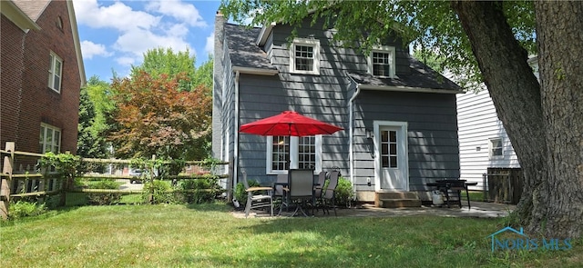 3329 Kirkwall Rd, Ottawa Hills, OH 43606 - rear view of house with a chimney, a patio area, a shingled roof, and entry steps