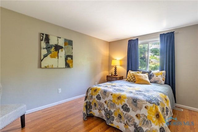 6768 Denbridge Dr, Sylvania, OH 43560 - bedroom with wood finished floors and baseboards