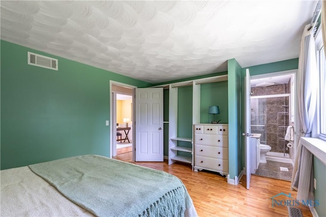 6768 Denbridge Dr, Sylvania, OH 43560 - bedroom with wood finished floors and connected bathroom