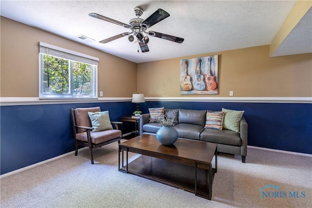 6768 Denbridge Dr, Sylvania, OH 43560 - carpeted living area with a ceiling fan and a textured ceiling