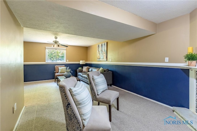 6768 Denbridge Dr, Sylvania, OH 43560 - living area featuring carpet, a textured ceiling, and a ceiling fan
