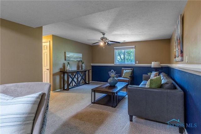 6768 Denbridge Dr, Sylvania, OH 43560 - carpeted living area featuring a ceiling fan and a textured ceiling