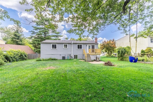 6768 Denbridge Dr, Sylvania, OH 43560 - rear view of property featuring stairs, a wooden deck, a chimney, and a fire pit