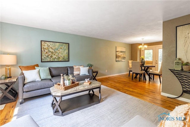 6768 Denbridge Dr, Sylvania, OH 43560 - living room featuring a chandelier and wood finished floors