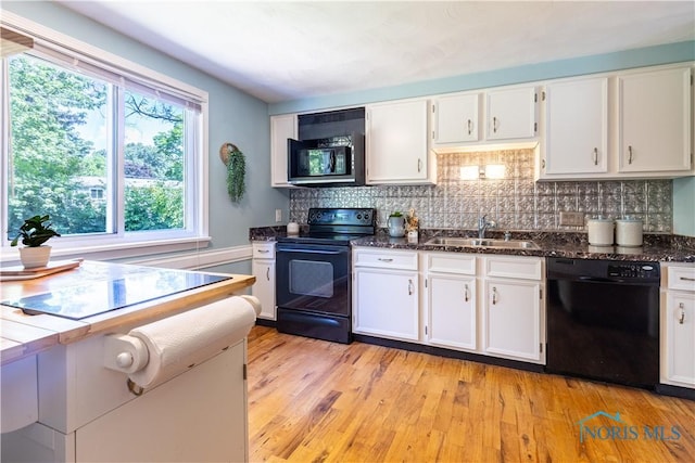 6768 Denbridge Dr, Sylvania, OH 43560 - kitchen featuring black appliances, white cabinets, decorative backsplash, and light wood finished floors