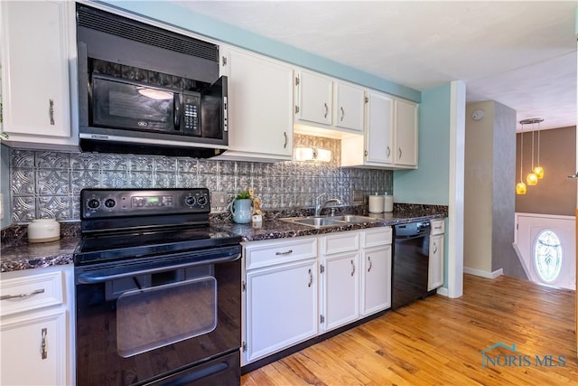6768 Denbridge Dr, Sylvania, OH 43560 - kitchen featuring black appliances, white cabinetry, backsplash, and light wood-style floors