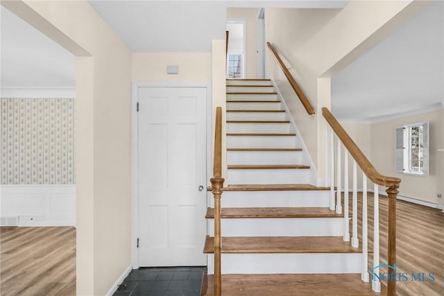 2310 Goddard Rd, Toledo, OH 43606 - stairs featuring wallpapered walls, wainscoting, and wood finished floors