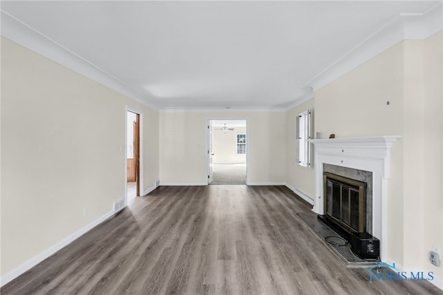 2310 Goddard Rd, Toledo, OH 43606 - unfurnished living room featuring wood finished floors, a high end fireplace, and a chandelier