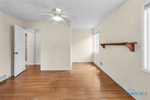 2310 Goddard Rd, Toledo, OH 43606 - unfurnished living room with wood finished floors and ceiling fan