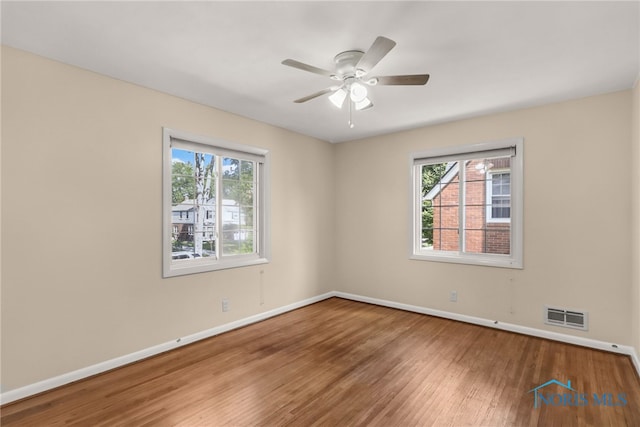 2310 Goddard Rd, Toledo, OH 43606 - spare room with healthy amount of natural light, wood finished floors, and a ceiling fan