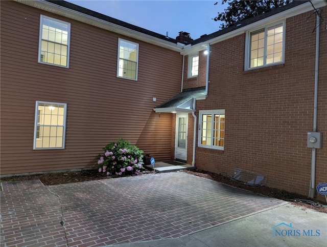 2310 Goddard Rd, Toledo, OH 43606 - rear view of property featuring a patio area and brick siding