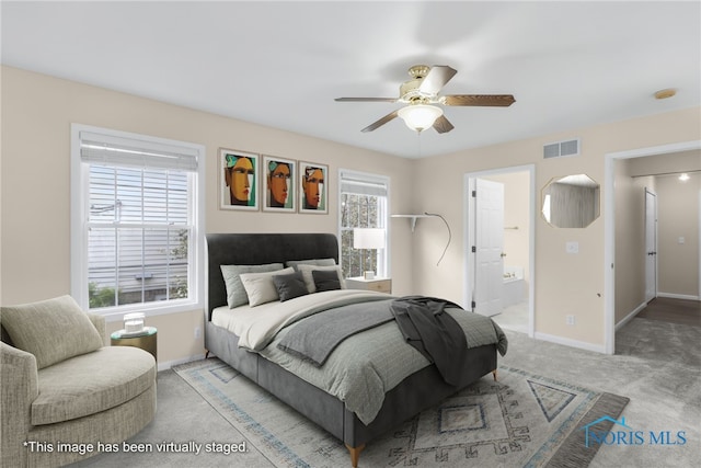 2310 Goddard Rd, Toledo, OH 43606 - carpeted bedroom with a ceiling fan and connected bathroom