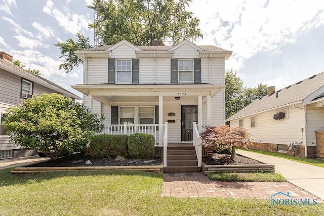 4334 Commonwealth Ave, Toledo, OH 43612 - view of front facade featuring a porch and a front lawn