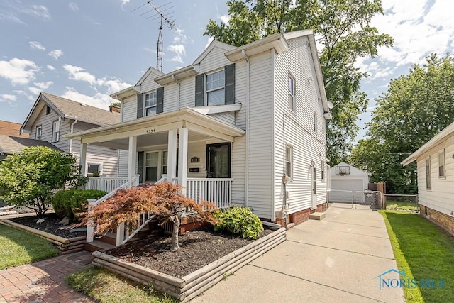 4334 Commonwealth Ave, Toledo, OH 43612 - view of front of property featuring covered porch, a garage, and an outdoor structure