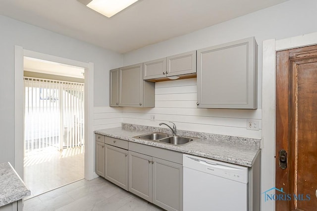 4334 Commonwealth Ave, Toledo, OH 43612 - kitchen with white dishwasher, gray cabinets, and light countertops