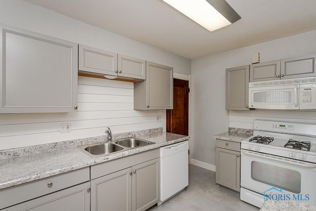 4334 Commonwealth Ave, Toledo, OH 43612 - kitchen featuring white appliances, gray cabinetry, light countertops, and light tile patterned floors