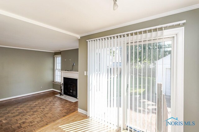 4334 Commonwealth Ave, Toledo, OH 43612 - unfurnished living room with plenty of natural light, crown molding, and a fireplace with flush hearth