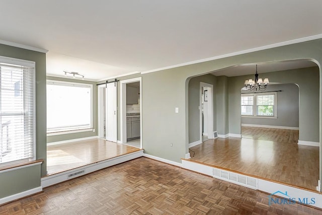 4334 Commonwealth Ave, Toledo, OH 43612 - unfurnished room with arched walkways, a chandelier, and ornamental molding
