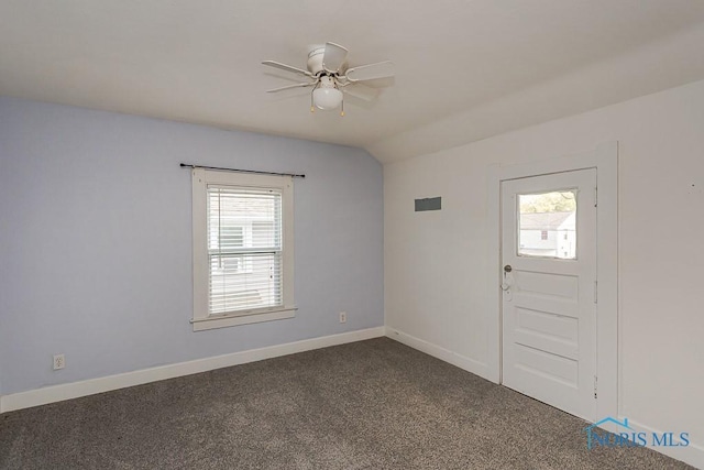 4334 Commonwealth Ave, Toledo, OH 43612 - entryway featuring ceiling fan, plenty of natural light, dark colored carpet, and lofted ceiling