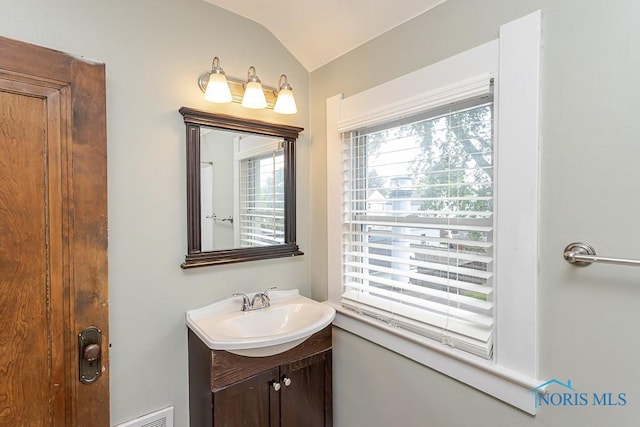 4334 Commonwealth Ave, Toledo, OH 43612 - bathroom featuring vanity and vaulted ceiling
