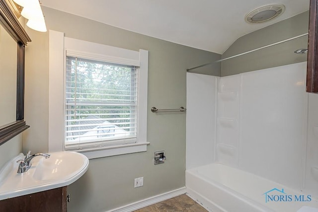 4334 Commonwealth Ave, Toledo, OH 43612 - full bath featuring healthy amount of natural light, vanity, lofted ceiling, and shower / bath combination