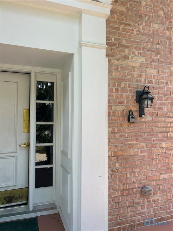 4243 W Bancroft St Unit 202W, Ottawa Hills, OH 43615 - property entrance featuring brick siding