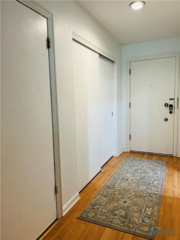 4243 W Bancroft St Unit 202W, Ottawa Hills, OH 43615 - corridor featuring light wood-style flooring and baseboards