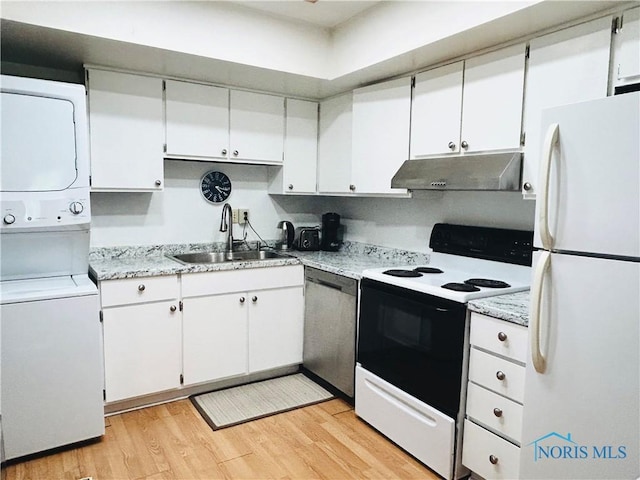 4243 W Bancroft St Unit 202W, Ottawa Hills, OH 43615 - kitchen featuring freestanding refrigerator, exhaust hood, range with electric stovetop, dishwasher, and estacked washer and dryer