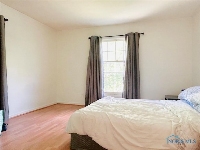 4243 W Bancroft St Unit 202W, Ottawa Hills, OH 43615 - bedroom featuring light wood finished floors and baseboards