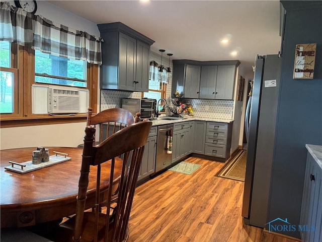 26654 Elliott Rd, Defiance, OH 43512 - kitchen with appliances with stainless steel finishes, gray cabinets, light wood-type flooring, cooling unit, and backsplash