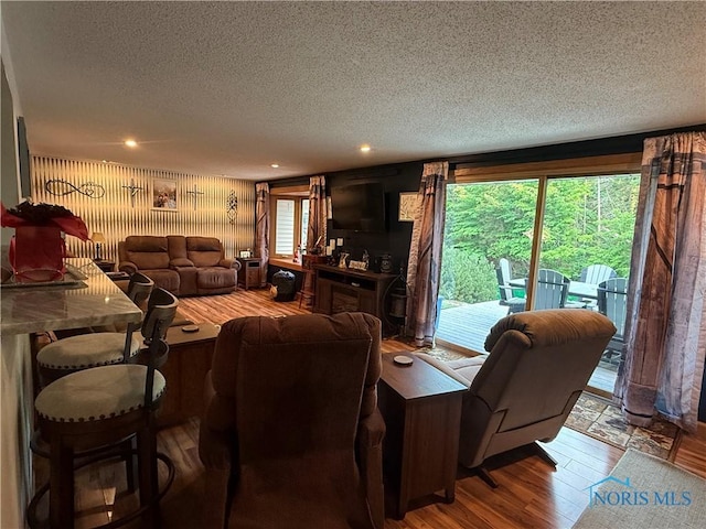 26654 Elliott Rd, Defiance, OH 43512 - living area featuring a textured ceiling, wood finished floors, and recessed lighting