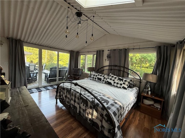 26654 Elliott Rd, Defiance, OH 43512 - bedroom with vaulted ceiling, access to outside, wood finished floors, and a skylight