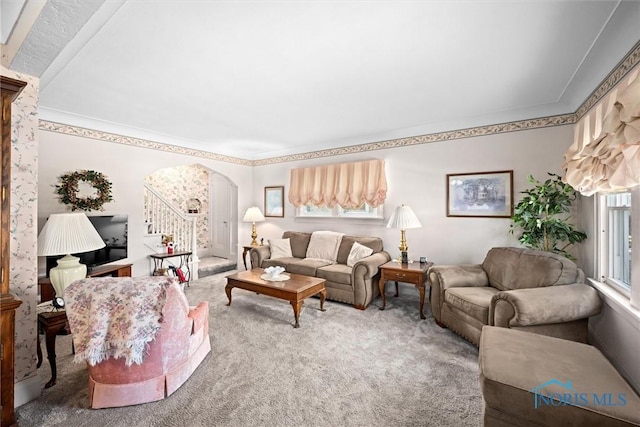 4526 Commonwealth Ave, Toledo, OH 43612 - carpeted living room with arched walkways, ornamental molding, and stairway