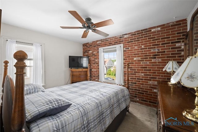 4526 Commonwealth Ave, Toledo, OH 43612 - bedroom featuring brick wall, carpet flooring, and ceiling fan
